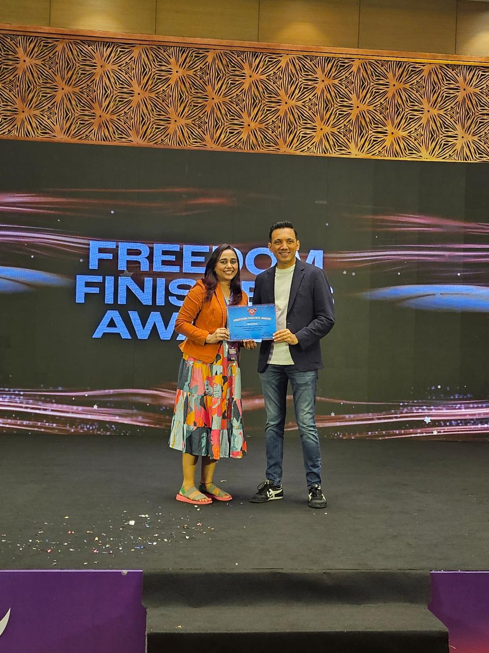 Freedom Finisher Award on stage at the Freedom Business Conclave