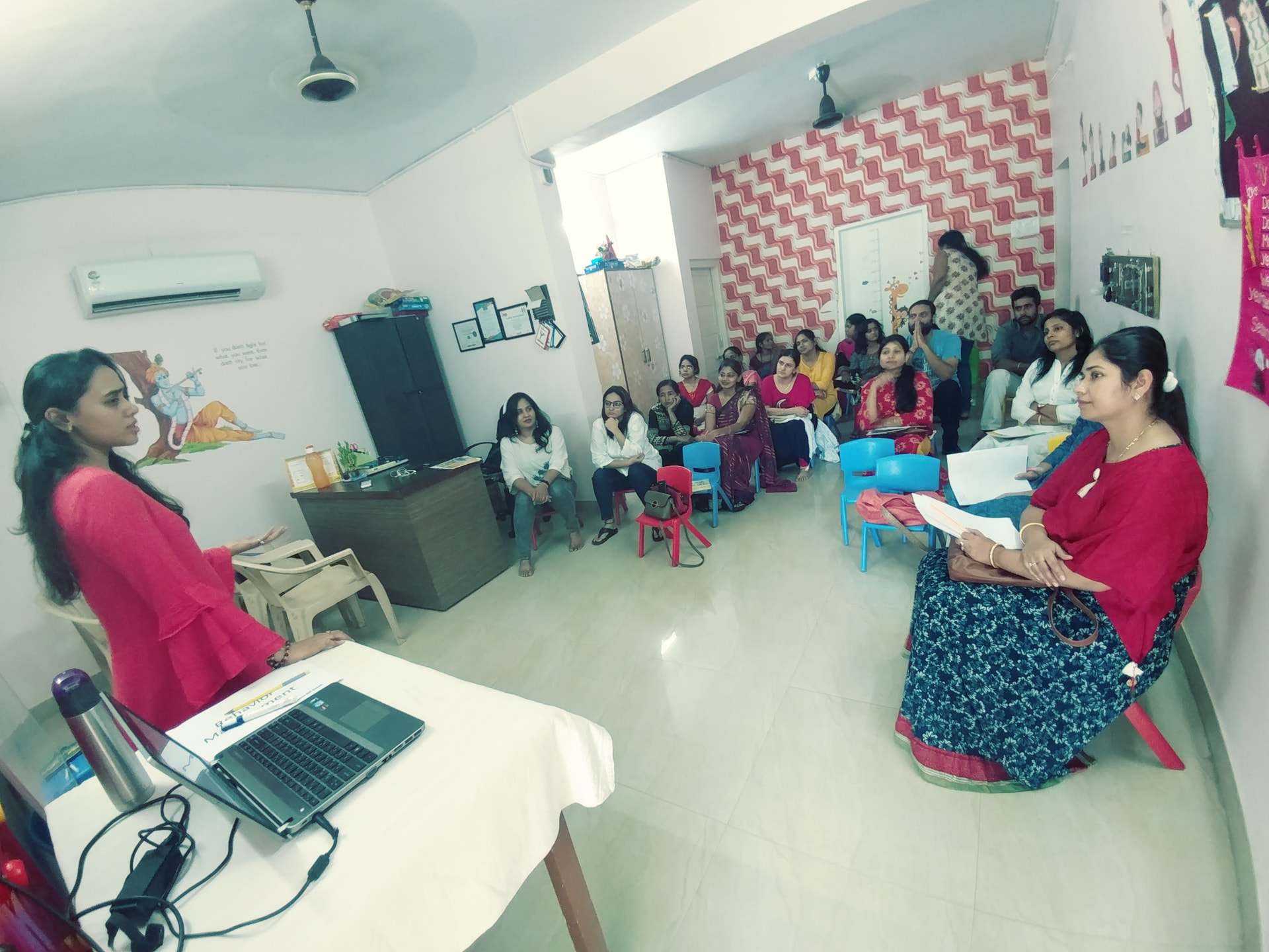 Leading a behaviour-management workshop for parents and teachers — the room where these tools were first tested